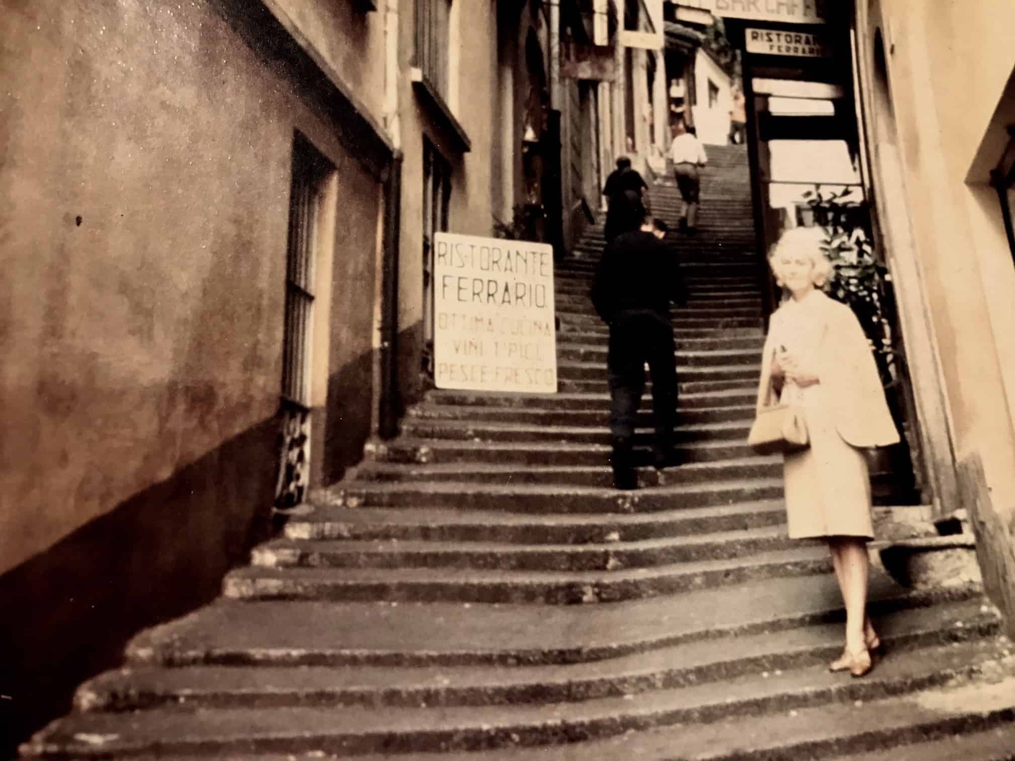 My Grandmother in Italy in the 1950's on the steps outside a restaurant.