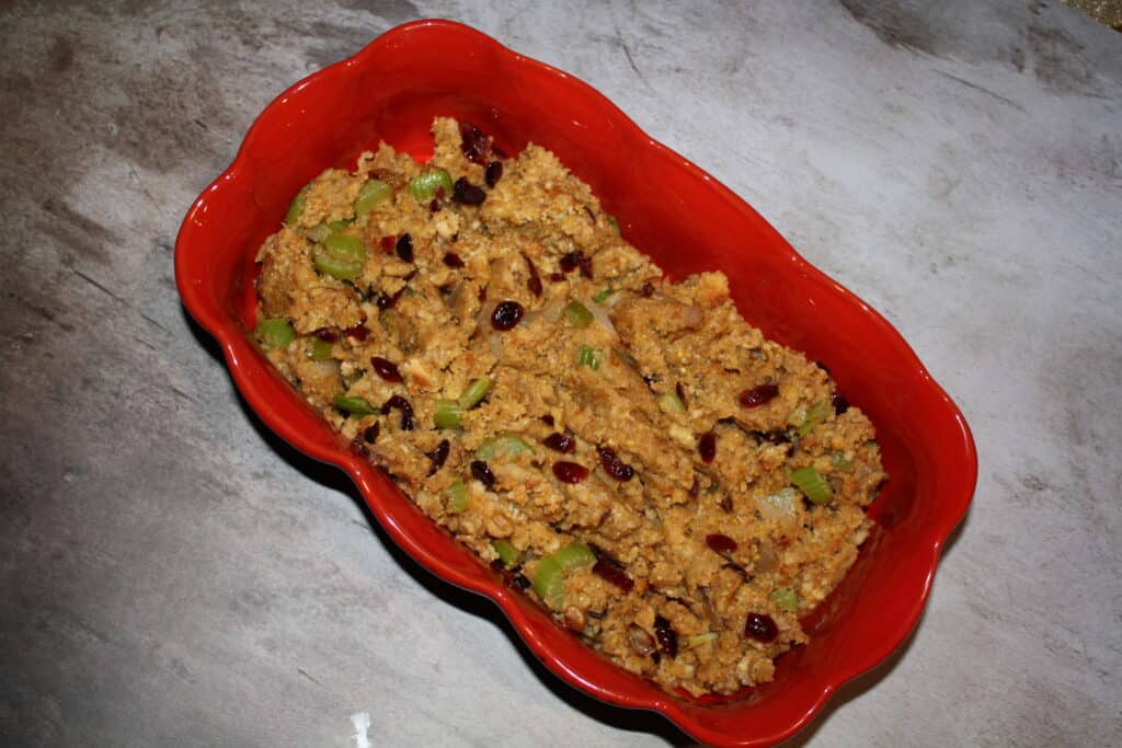 Easy Waldorf Cornbread Stuffing in a red dish