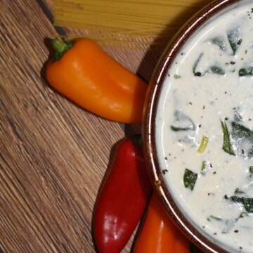 Feta Cream Cheese Alfredo Sauce on a bowl with peppers