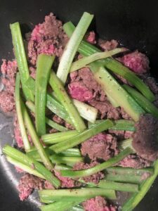 Browning ground beef with celery added