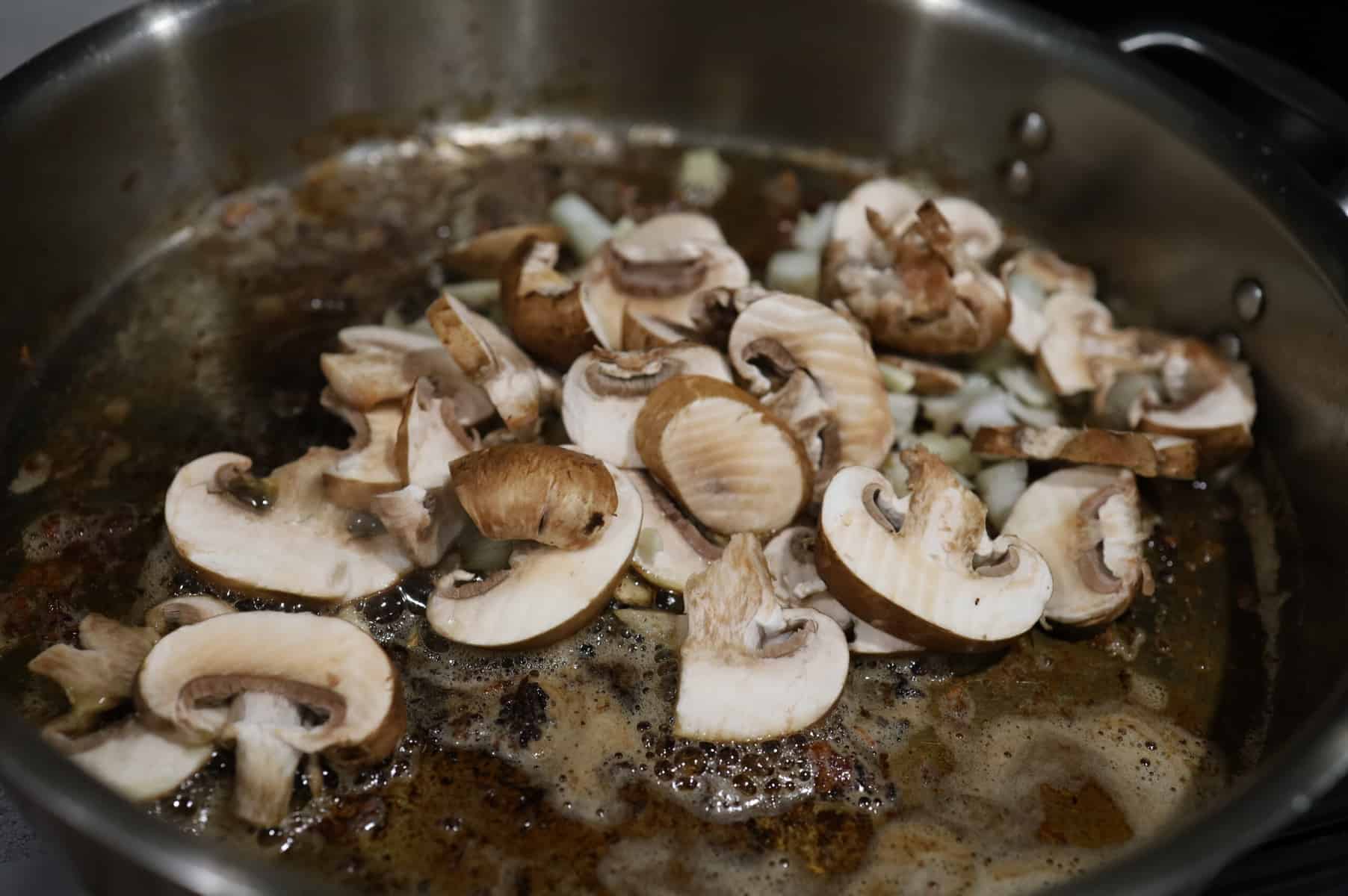 fresh cut mushrooms in the pan.