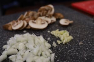Sliced mushrooms, diced onions and minced garlic for chicken marsala.