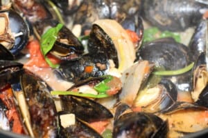 Mussels with Tomatoes & Wine Sauce is a well-loved delicacy served a few times a year at my house! 