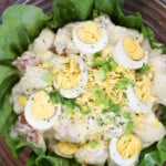 Potato Salad with Mayo and Lemon Juice in a bowl over lettuce