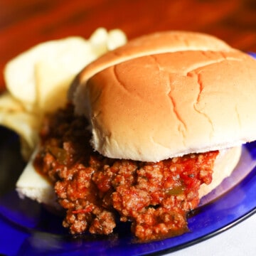 Sloppy Joes made from scratch on a roll with chips on the side.