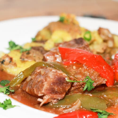 Savory Swiss Steak Creole with parsley garnish